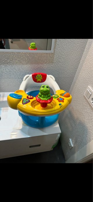 Asiento de baño para bebé con juguetes