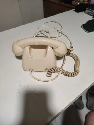 Teléfono antiguo ruleta beige