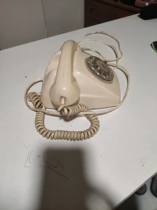 Teléfono antiguo ruleta beige