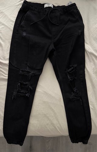 Pantalones negros baggy rotos