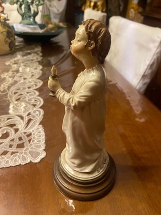 Statua angioletto con candela Merli
