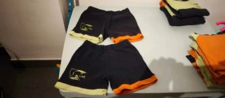 Ropa Fundacio Llor Negra y Naranja