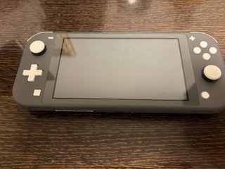 Nintendo Switch Lite Gris + Como nueva + Extra