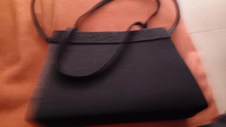 Bolso de fiesta negro con flores