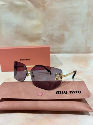Gafas de sol Miu Miu doradas y moradas