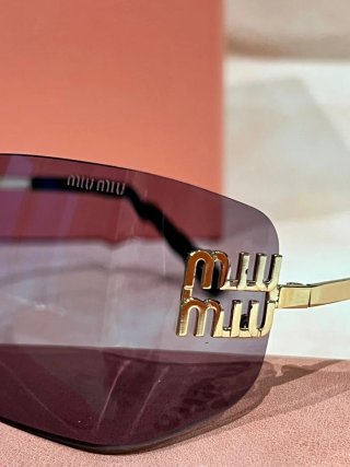 Gafas de sol Miu Miu doradas y moradas