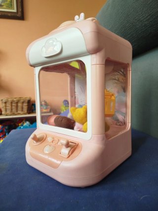 Máquina de gancho de juguete rosa
