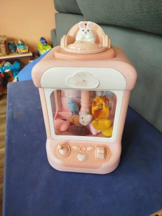Máquina de gancho de juguete rosa