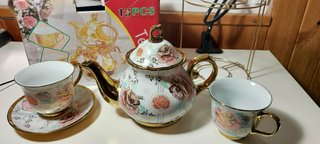 Juego de té porcelana 13 piezas con soporte