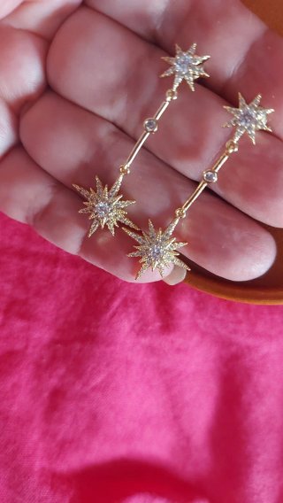 Pendientes largos estrella con circonitas
