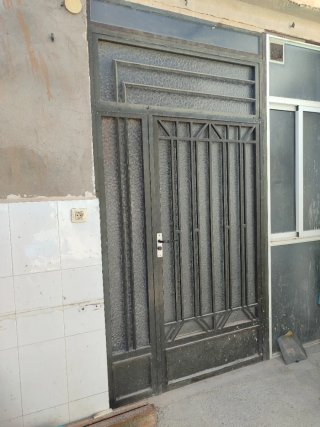 Puerta metálica de patio con cristal 143×2,70