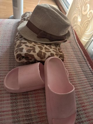 Large beach towel, chunky flip flops and hat