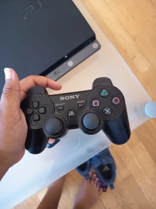 Playstation 3 Slim Negra + Juegos