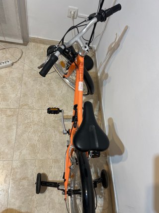 Bicicleta naranja RIVERSIDE sin usar