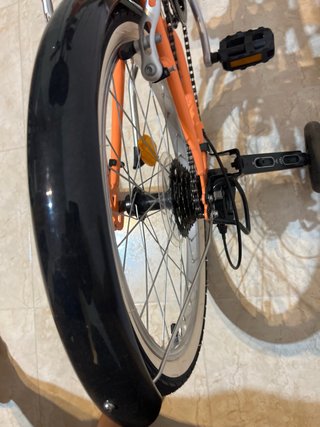Bicicleta naranja RIVERSIDE sin usar