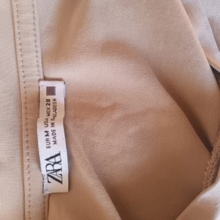 Camiseta sin mangas corta beige,