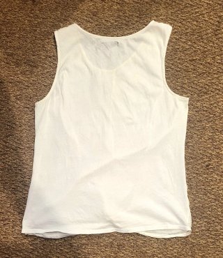 Camiseta Sfera sin mangas con nudo en cintura.