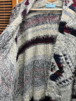 Poncho punto estilo boho con flecos
