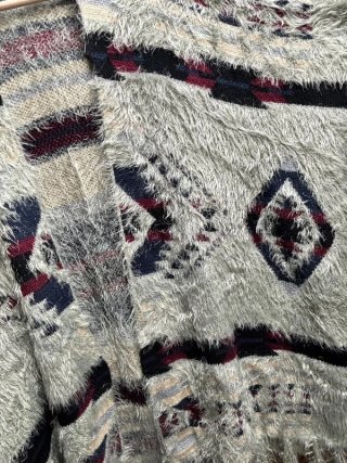 Poncho punto estilo boho con flecos