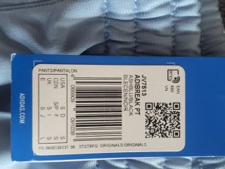 Pantalón Adidas azul y blanco