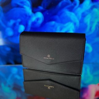 Bolso de mano Anna Field negro y dorado