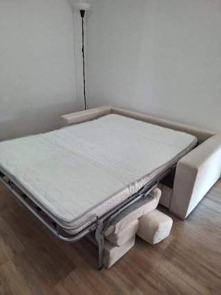 Sofá cama dos plazas beige El corte Inglés