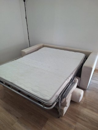Sofá cama dos plazas beige El corte Inglés