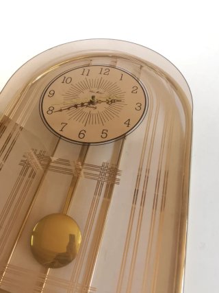 Reloj vintage de péndulo de cristal y metal 80's