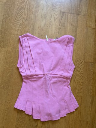 Blusa Zara rosa con cremallera y volantes
