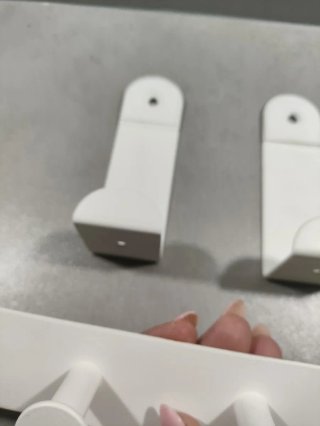 Perchero de pared metálico blanco