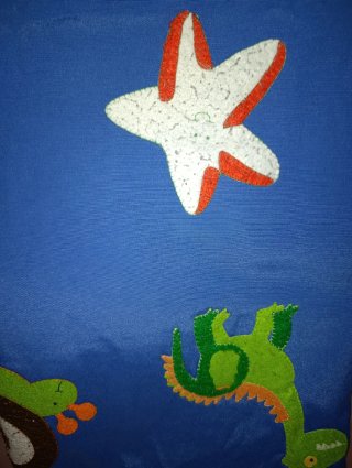 Colcha infantil con animales de fieltro
