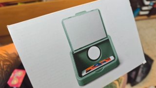 Proyector móvil gris y verde
