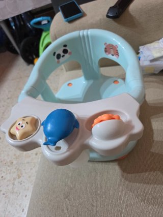 Asiento de baño para bebé con juguetes