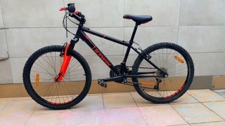 Bicicleta Rockrider BTWIN 24 Negra/naranja