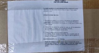 Barbacoa de piedra con base metálica