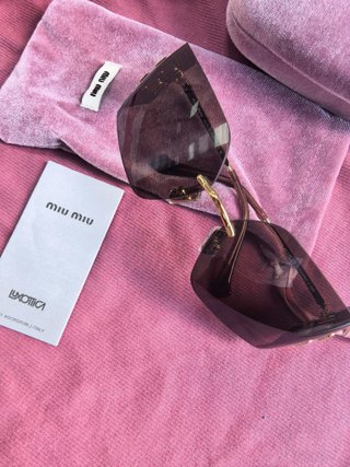 Gafas de sol Miu Miu marrones y doradas