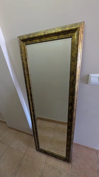Espejo de pared dorado y marrón