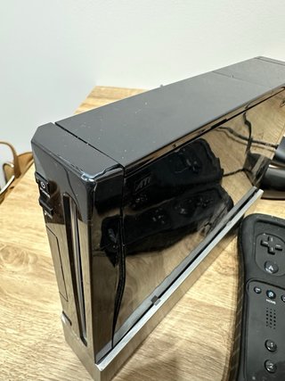 Consola Wii Negra con mandos y juegos