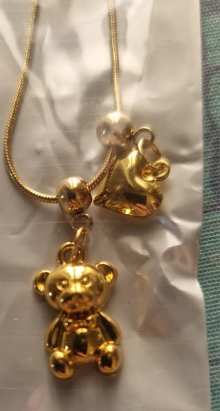 Collana con orsetto e campanella dorata