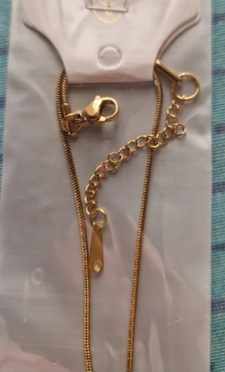 Collana con orsetto e campanella dorata