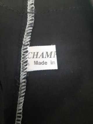Pantaloni neri con scritte orientali