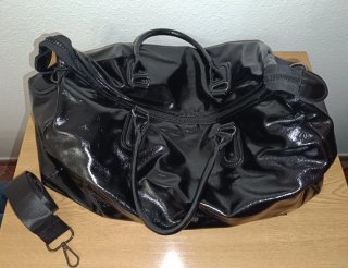 Bolso de viaje negro brillante