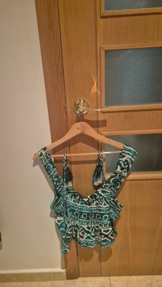 Top estampado tribal con flecos