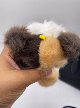 Peluche gato calicó con pompón