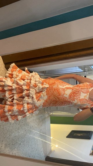 Traje de flamenca naranja y blanco