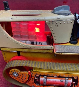 Tractor hojalata  a batería de juguetes Nomura TN