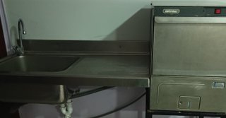 Mesa de acero inoxidable con estante