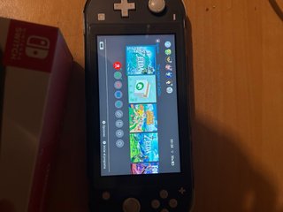 Nintendo Switch Lite negra con caja