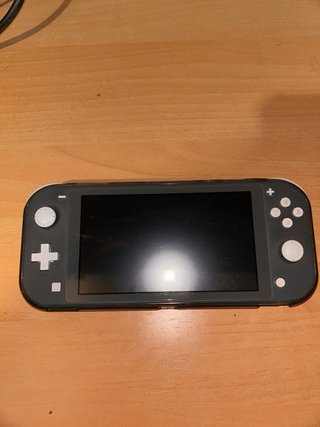 Nintendo Switch Lite negra con caja
