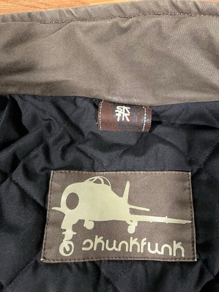 Chaqueta Skunkfunk verde militar multipocket